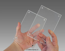 Load image into Gallery viewer, Holding two separate pieces of acrylic with magnets on corners